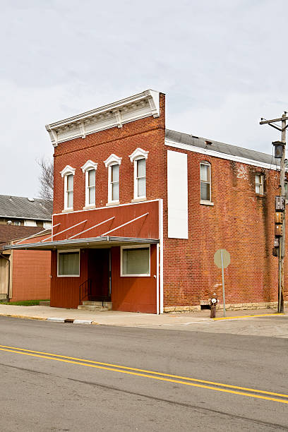 old brick building an old red brick building on a steet corner.RELATED: old candy store stock pictures, royalty-free photos & images