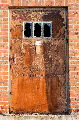 rusty door at old industrial building