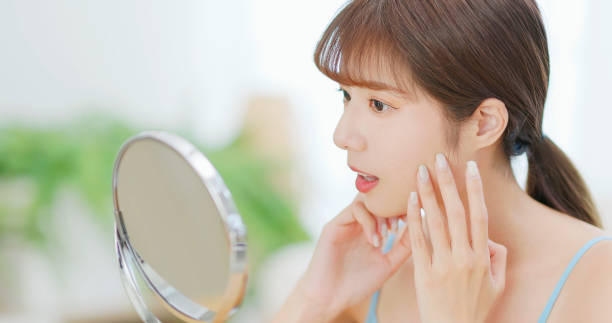 istock Young asian woman look mirror 1724016039
