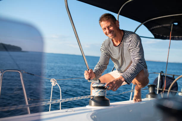 istock Man in a striped shirt sailing on a yacht 1724016603