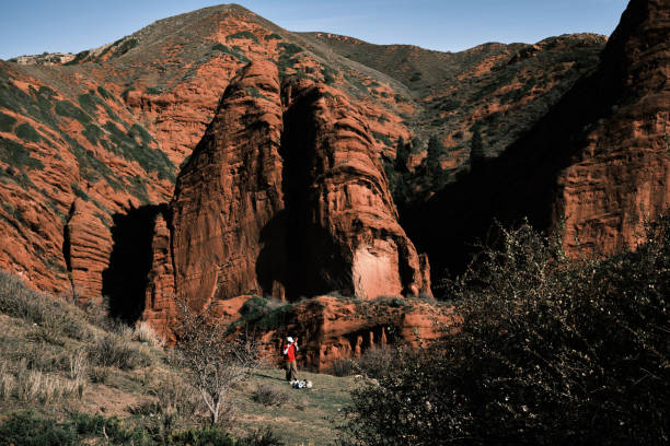 istock Single female hiker is making fireplace in mountains 1724016622