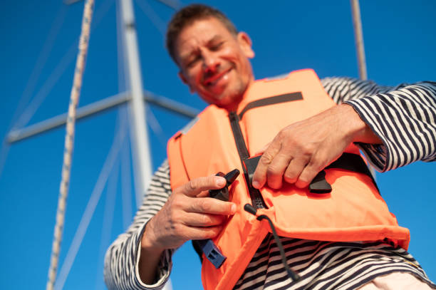 istock Mature man in a life jacket on a yach feeling good 1724017196