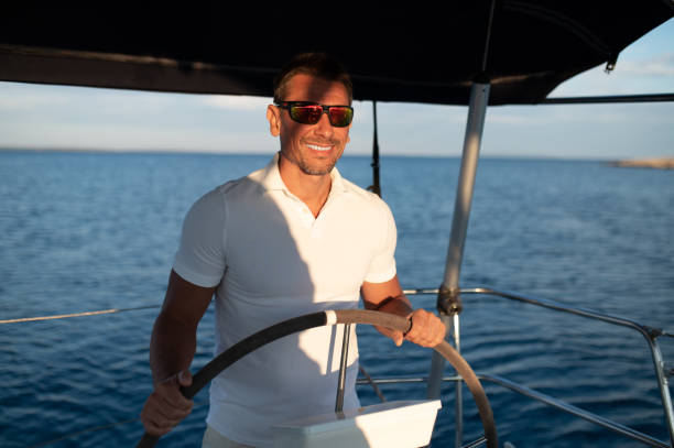 istock Short-haired confident mature man sailing on a yacht 1724017293
