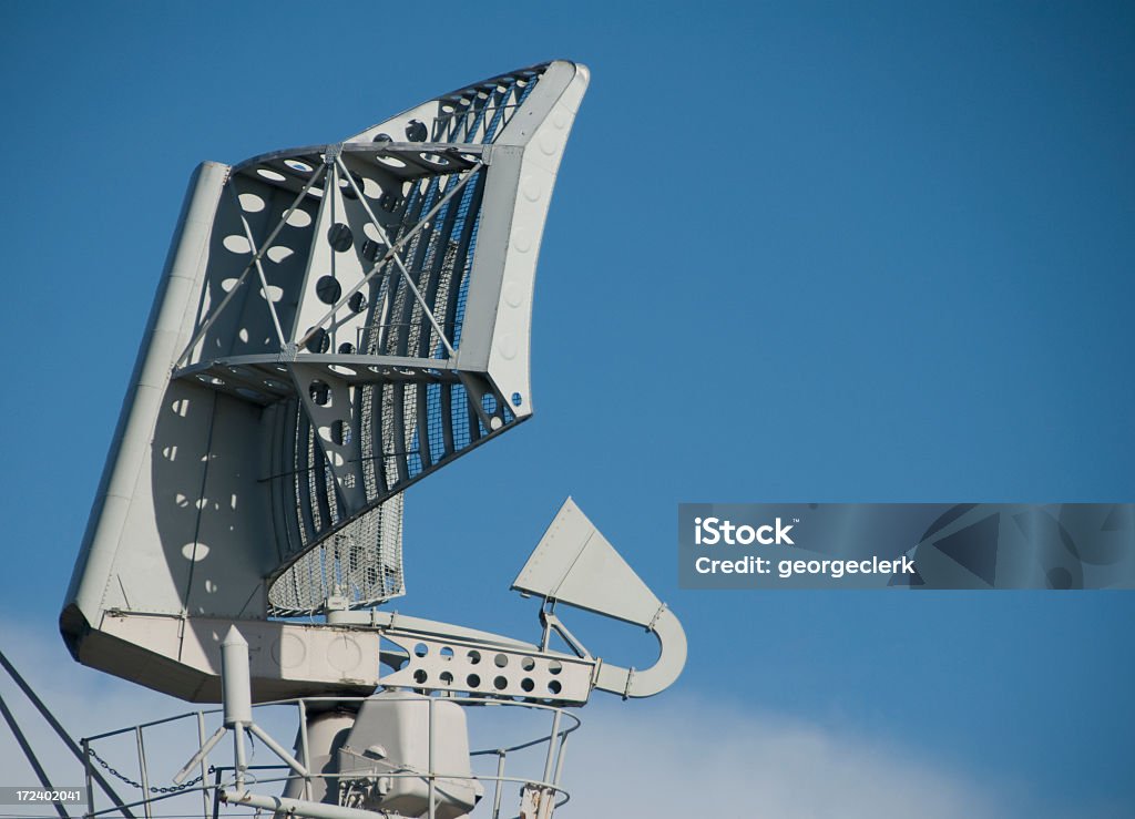 Military Radar Close-up Radar against a blue sky, vignetting added intentionally. Antenna - Aerial Stock Photo