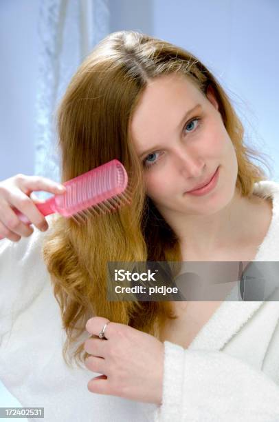 Young Women Brushing Hair Stock Photo - Download Image Now - Adult, Adults Only, Backgrounds