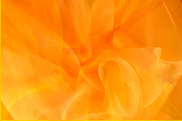 鮮やかなオレンジとゴールドの渦巻き - flowing light wave pattern pattern ストックフォトと画像