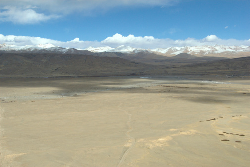 The barren landscape before Gandise mountain range.  Gandise mountain range is the home of Mt Kailash (Gang Rinpoche) which is one of the most sacred mountain in Asia.