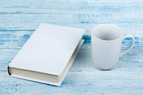 istock Open book, hardback books on wooden table and blue background. Back to school. Copy space for text. 1724034909