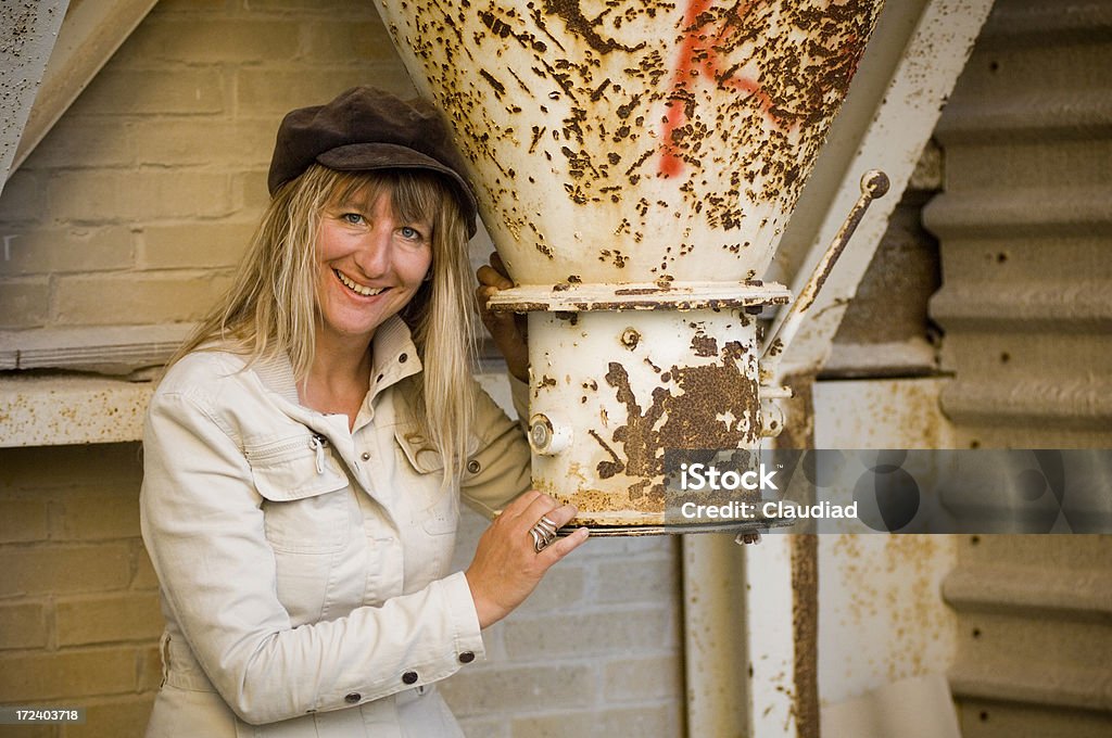 Factory portraits "Woman, 40 years old, in old factory, see other pics of that model:" 35-39 Years Stock Photo
