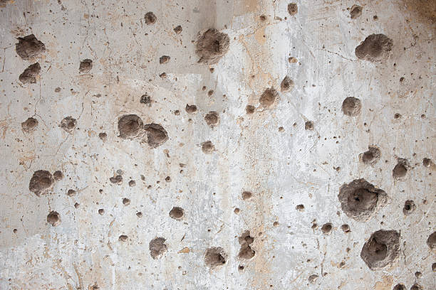 istock Bullet Holes on a Wall 172403746