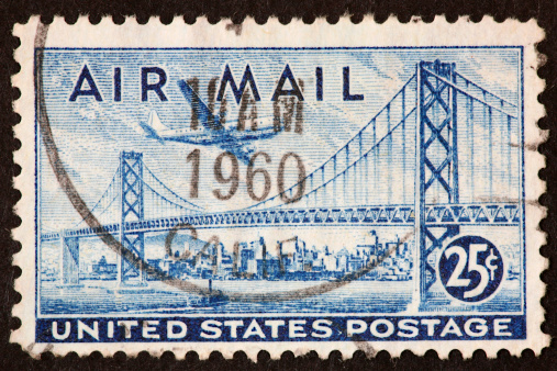 airmail stamp with the Oakland-SanFrancisco Bay Bridge.