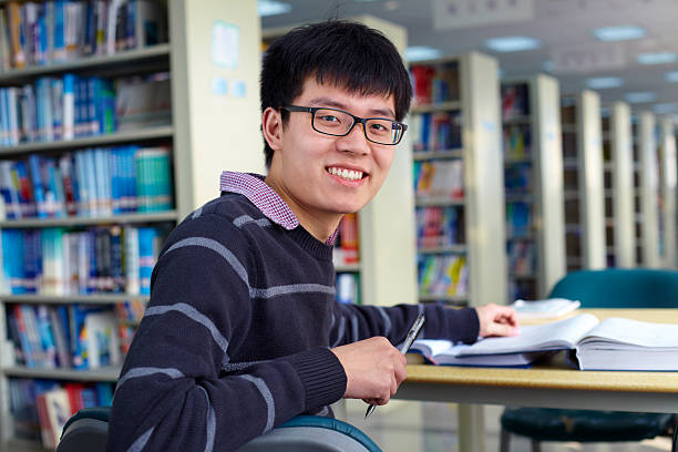 istock male college student in library 172404487