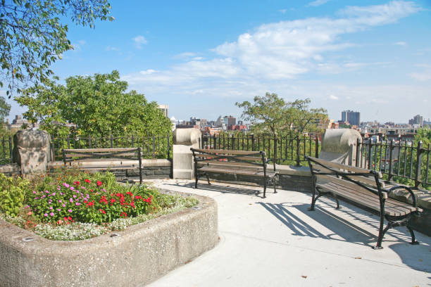 Promenade Overlooking City "Wooden benches in Morningside Park with view of Harlem, Manhattan, New York City, NY, USA." harlem park stock pictures, royalty-free photos & images