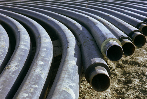 Bent Pipe Stored Prior to Being Placed Underground to Transmit Oil or Gas