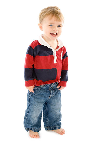 istock Smiling little boy standing on white background 172404795