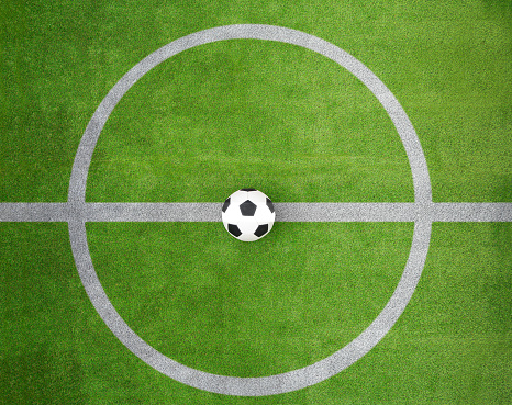 Soccer field center and ball top view background at stadium