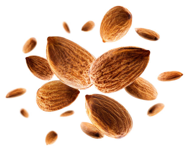 istock Perfectly retouched almond levitates in space. Volumetric back light. Isolated on white. 1724054096