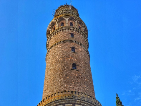 detail of an ancient tower contrasting with the blue sky