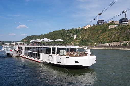 Koblenz, Germany - September 3, 2016: river cruise ship ‘Viking Vidar’ with Rhine cable car and Fortress Ehrenbreitstein in the background
