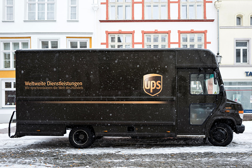 Wismar, Germany - November 9, 2016: UPS delivery van during snowfall
