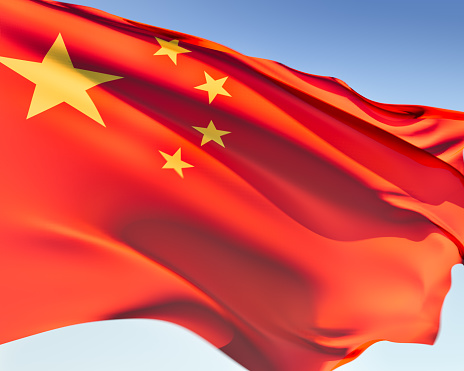 Chinese flag waving in the wind. Elaborate rendering including motion blur and even a fabric texture (visible at 100%).