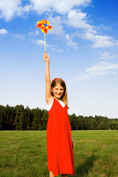 istock Girl with pinwheel 172406900