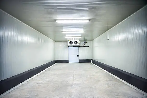 "Empty storage in a meat processing factory. Big Industrial refrigerator or dryer for any kind of food, meat, fruit or vegetable. From -10 to -80 degrees celcius.See more images like this in:"