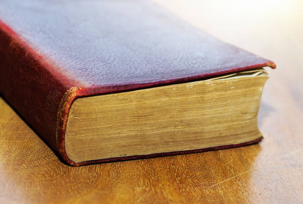 Very old book lying on a desk.