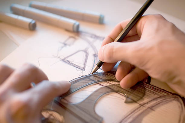 Industrial Designer scribbling Industrial-designer drawing sketches for a project using a curve ruler. product designer photos stock pictures, royalty-free photos & images