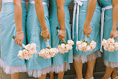 Bridesmaids with aqua dresses and bouquets