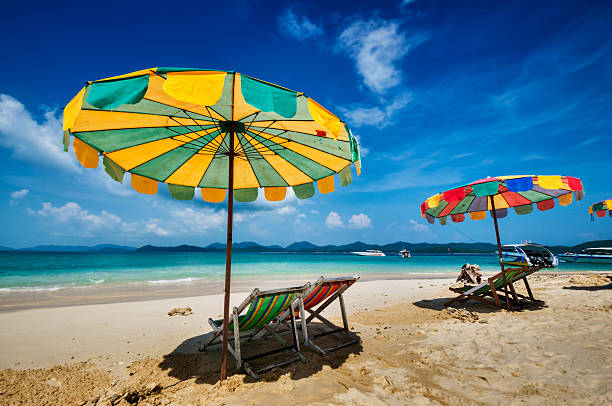 istock White Sandy Beach with Chairs and Umbrellas 172408295