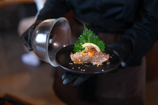 istock Close up hand holding Smoked Sushi 1724084161