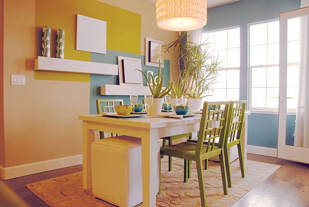 istock Luxury home with blue and yellow kitchen with green chairs 172408492