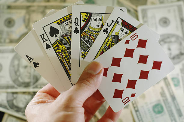 istock Full house playing cards with money background 172409346