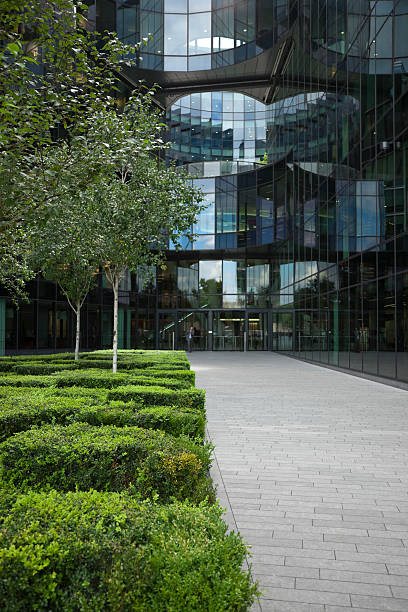 istock Walkway to Modern Office Building with Parterres and Trees 172409381