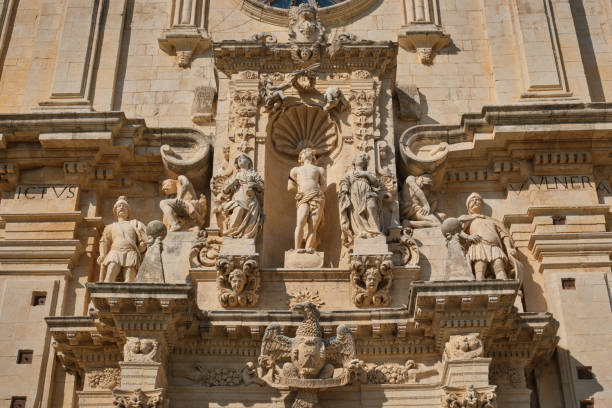 istock Front sculpures from St. Sebastian Basilica in Ferla, Sicily 1724097221