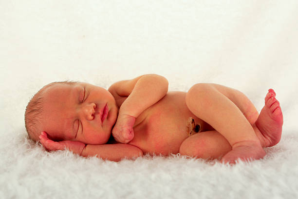 Infant sleeps soundly at only 5 days old stock photo