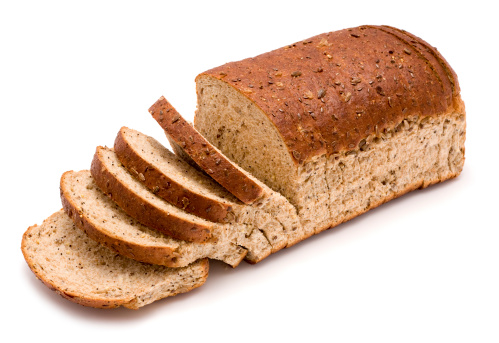 Brown sliced bread on a white background.
