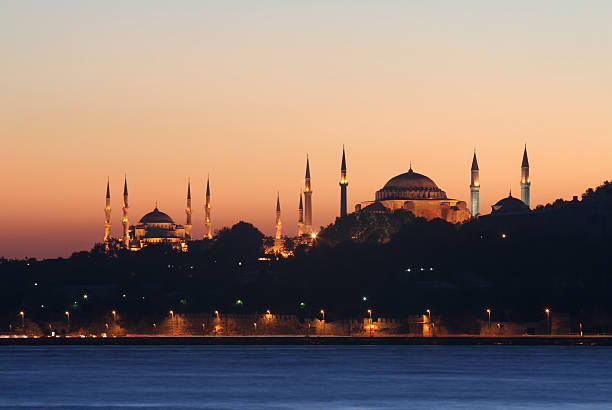 Blue mosque and  Hagia Sofia The view of Blue mosque and  Hagia Sofia after sunset from Uskudar seashore. ( Istanbul/Turkey ) sultanahmet district photos stock pictures, royalty-free photos & images