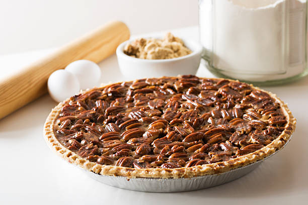 Pecan Pie, Fresh Baked Holiday Dessert with Ingredients, Rolling Pin stock photo