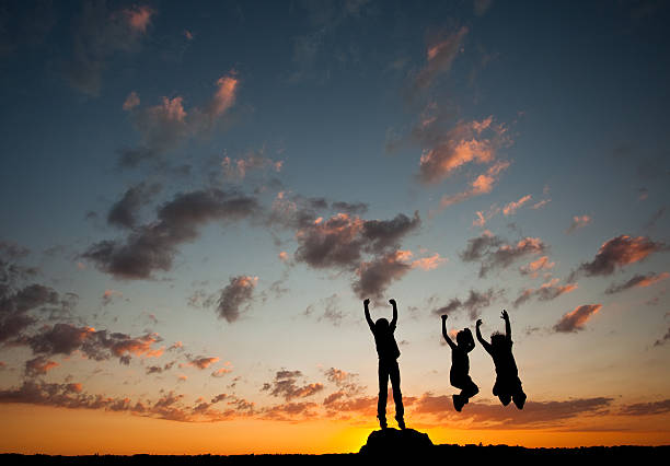 istock Silhouette of Young Boys Jumping 172410676