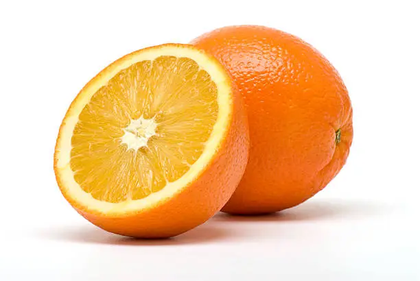 Two perfectly fresh oranges isolated on white.Click on the banner below to see more photos like this.