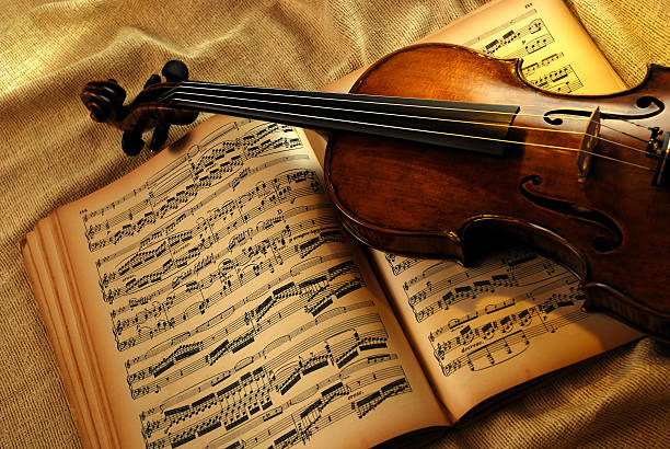 Violin and very old notes stock photo