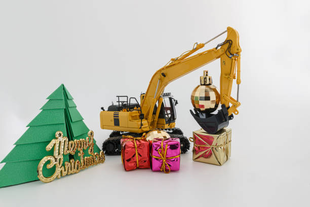 istock Christmas ornament and Excavator model 1724128851