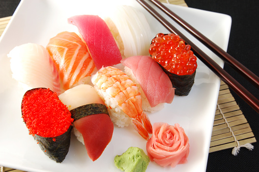 Variety of sushi on square plate