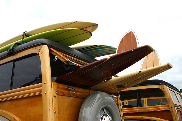 A few woodie cars lined up at the wharf.