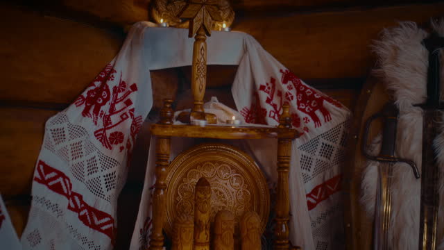 culture and tradition of Slavic paganism, altar with idols, amulets and candles in house, 4K, Prores