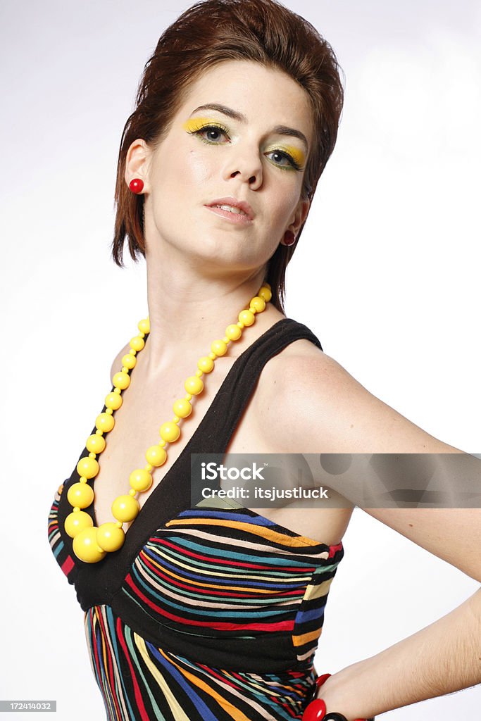 Bold and Beautiful Beautiful young woman dressed in bold and beautiful retro fashions. Kitsch Stock Photo