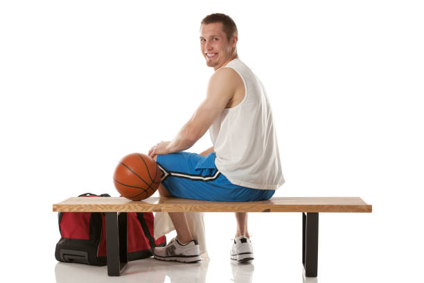 istock Happy basketball player sitting on a bench 172414448