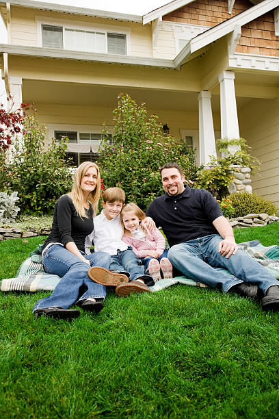 istock Happy Young Family at Home in Front Yard 172414531